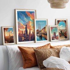 Vibrant Chicago poster alongside travel prints of Copenhagen and Barcelona, decorating a cozy bed with decorative pillows.