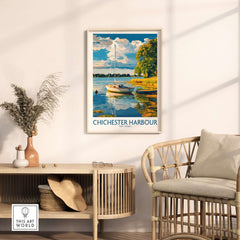 Chichester Harbour Art Print displayed in a stylish room with a boat and scenic landscape.