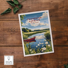 Chichester Harbour Print featuring a serene landscape with a boat, flowers, and blue sky on a wooden table.