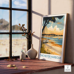 Chichester Harbour Travel Poster displayed near a window, showcasing vibrant coastal scenery and boats.