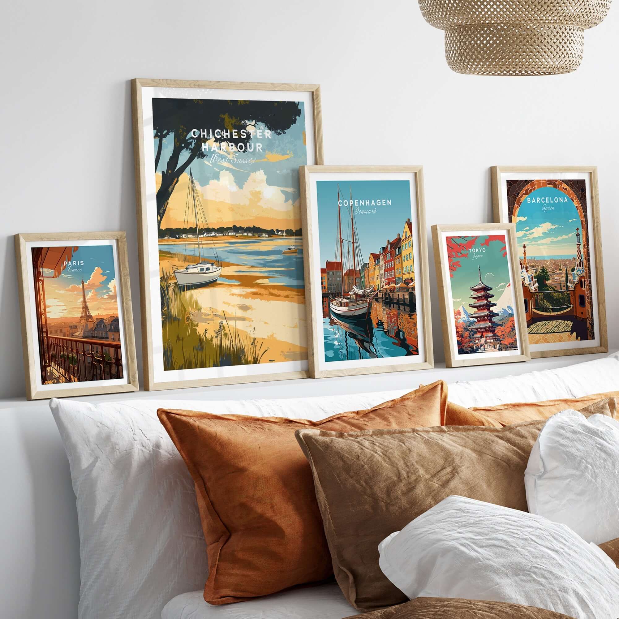 Framed Chichester Harbour Travel Print alongside other travel prints in a stylish home decor setting.