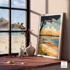 Chichester Harbour Travel Print displayed on a wooden table with a serene coastal view in the background.