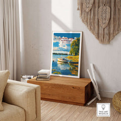 Chichester Harbour Wall Art displayed in a cozy living room setting, featuring vibrant colors and serene coastal scenery.