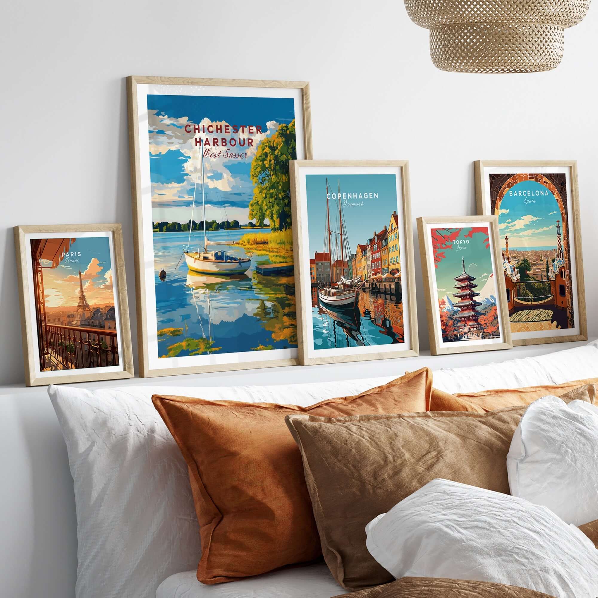 Chichester Harbour Wall Art collection displayed in stylish frames, showcasing vibrant coastal scenery.