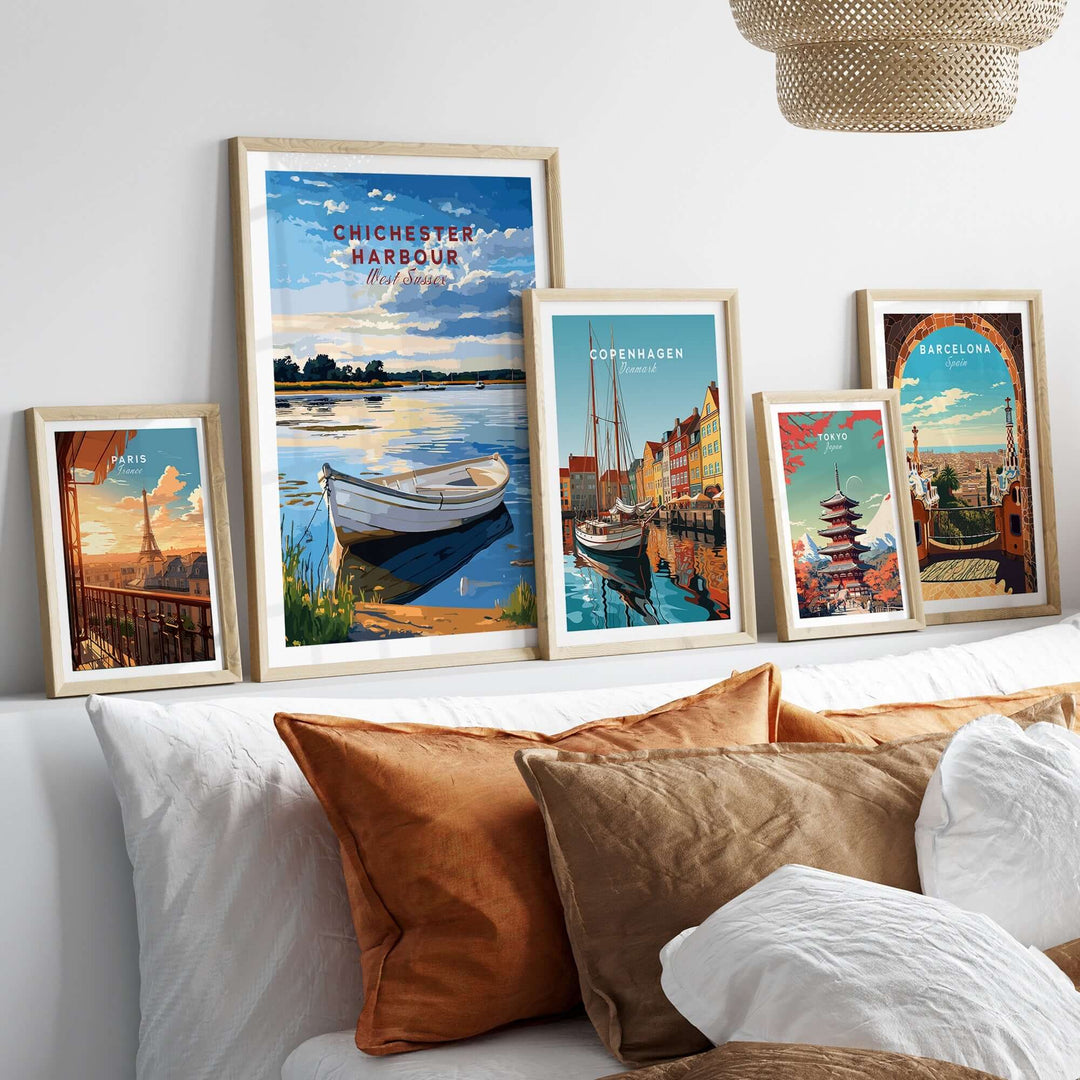 Chichester Harbour travel print displayed alongside other vibrant city prints in a cozy living room setting.