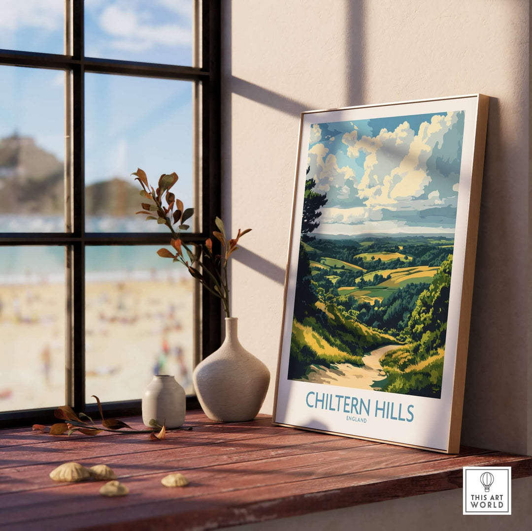 Chiltern Hills print displayed on a wooden table by a window, showcasing a vibrant landscape of the English countryside.