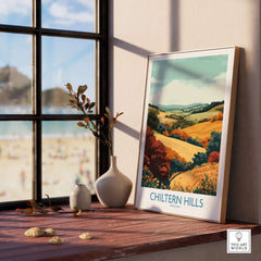 Chiltern Hills Travel Poster beautifully displayed on a wooden table with a scenic view through the window.
