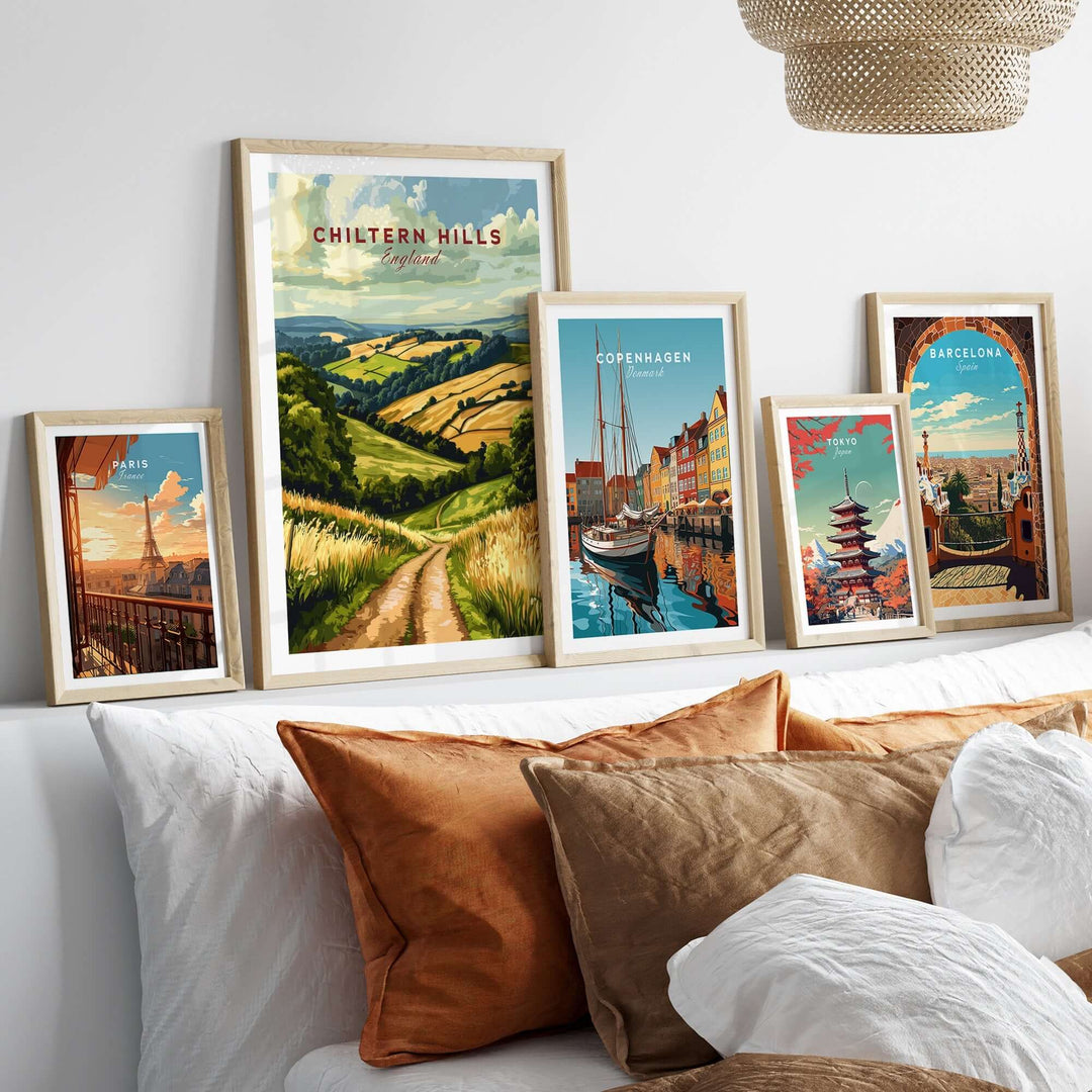 Framed Chiltern Hills Wall Art and travel posters adorn a stylish living room with cozy cushions and soft textures.