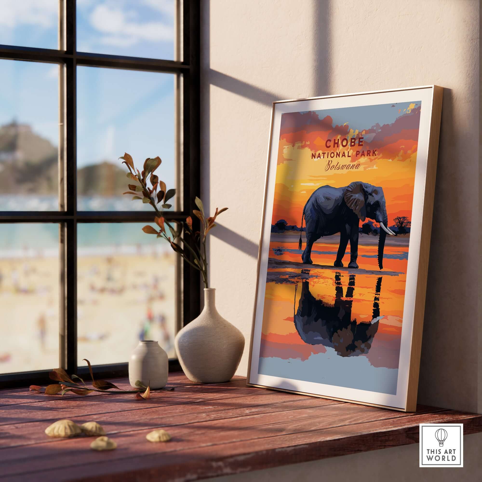 Chobe Elephant Digital Art Print - Botswana Wildlife Illustration Poster on a wooden table by a window with beach view.