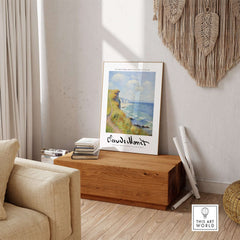 Claude Monet Art Print - Coastal Cliff Path Seascape Wall Art displayed in a cozy living room setting.