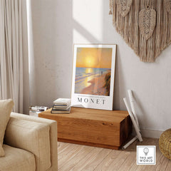 Claude Monet Art Print - Golden Hour Beach Stroll Wall Art displayed in a cozy living room setting.