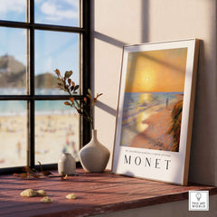 Claude Monet Art Print - Golden Hour Beach Stroll Wall Art displayed by a window with a beach view.