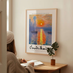 Claude Monet Art Print - Impressionist Sunrise Harbor Wall Art displayed in a cozy interior setting.