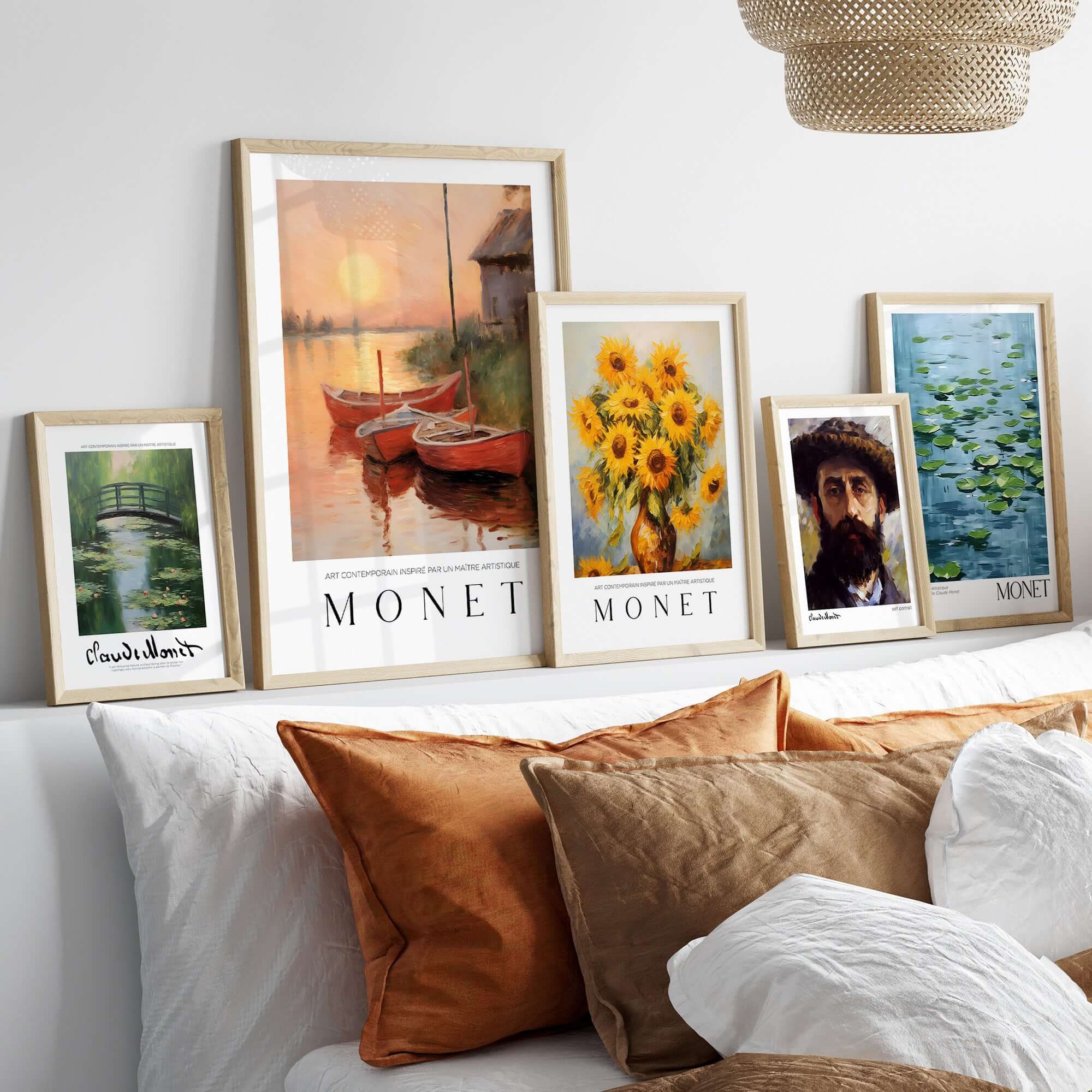 Claude Monet Art Print - Red Boats at Sunset Riverbank Wall Art framed alongside other Monet works on a cozy interior shelf.