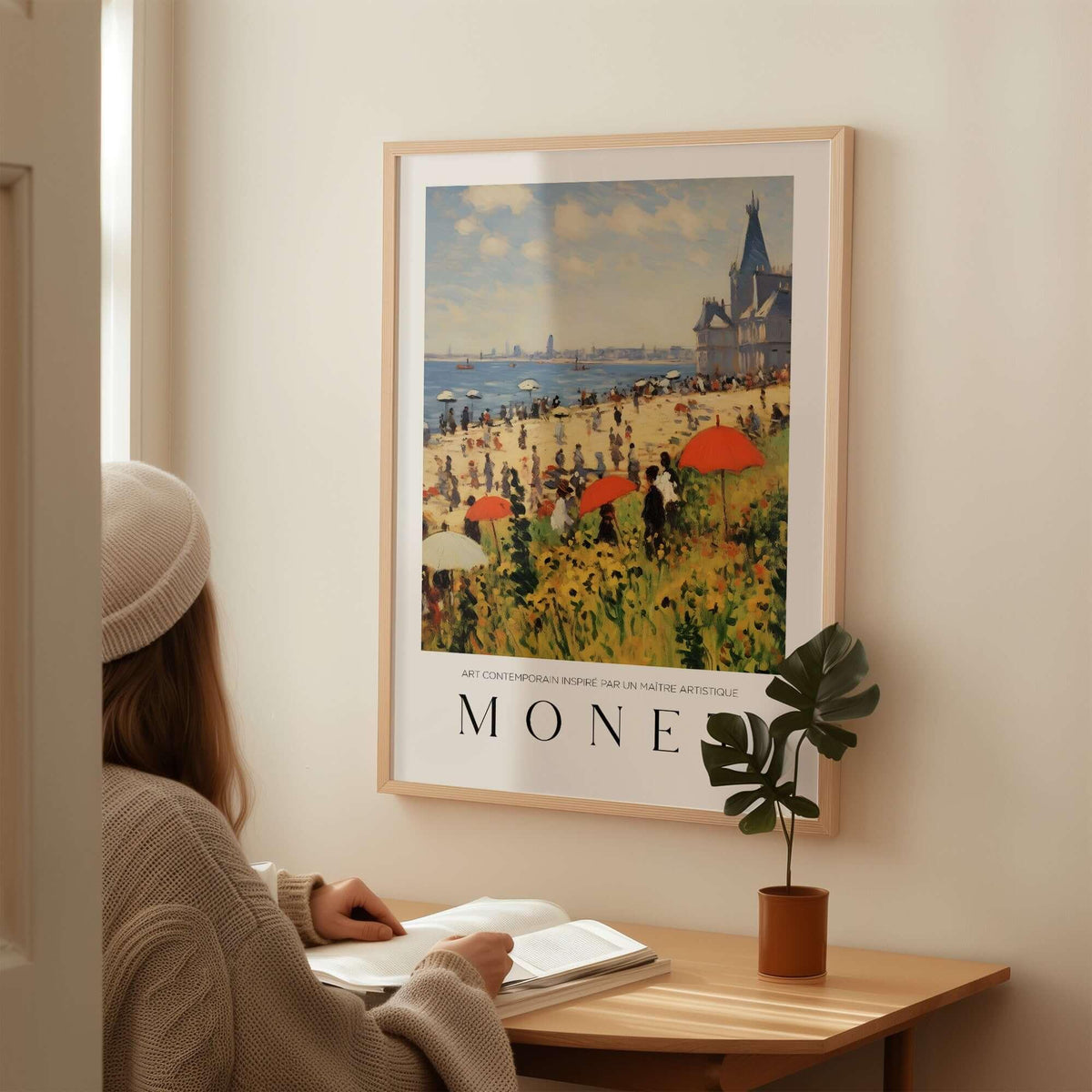 Claude Monet Art Print - Sunny Beach Resort with Flowers Poster displayed on a wall with a woman reading nearby.