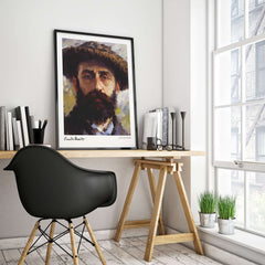 Claude Monet Self Portrait Wall Art - Impressionist Poster Print displayed in a modern workspace with a stylish black chair.