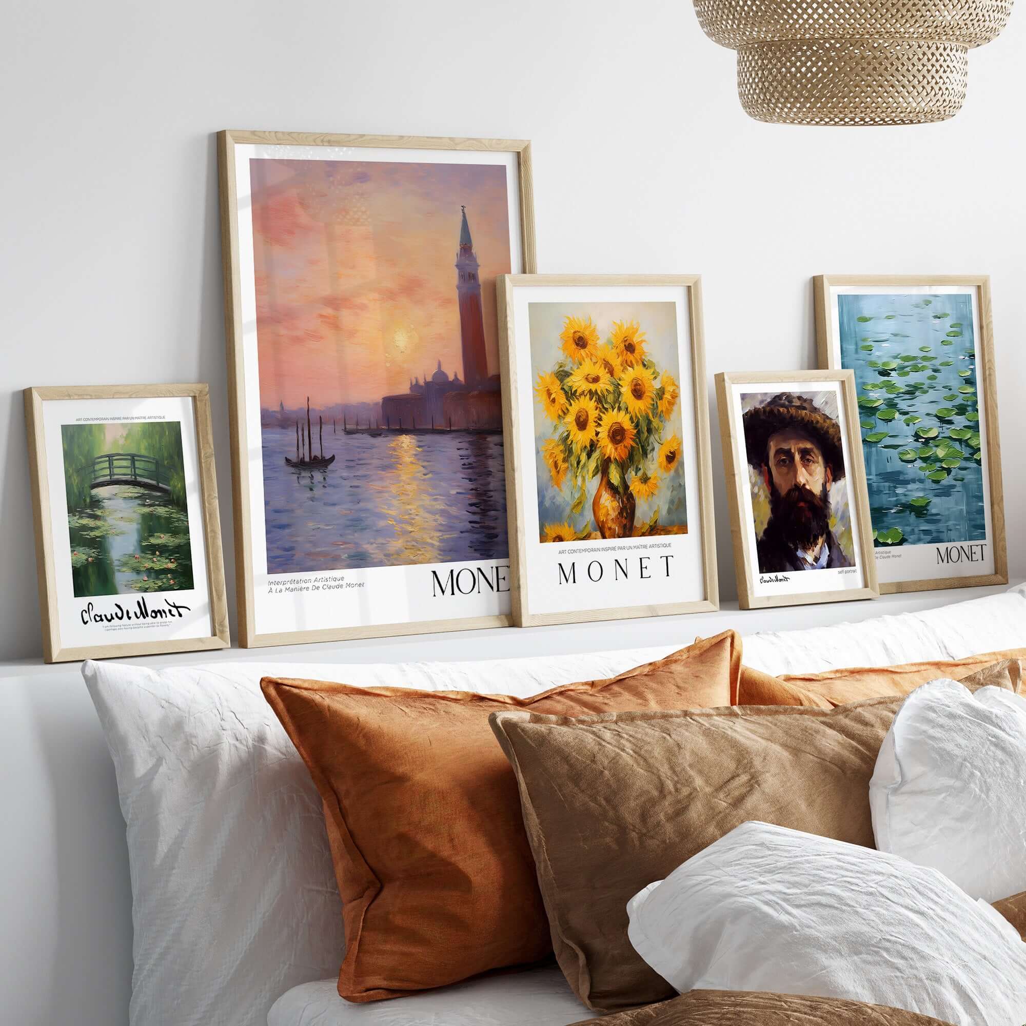 Monet Venice wall art and impressionist prints displayed above a cozy couch with decorative pillows.