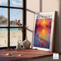 Claude Monet Vibrant Sunset Water Lilies Wall Art - Lake Reflection Print displayed on a window sill with beach view.