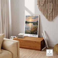 Claude Monet Wall Art Print - Sunset River Poppies displayed in a modern living room with warm hues and floral accents.