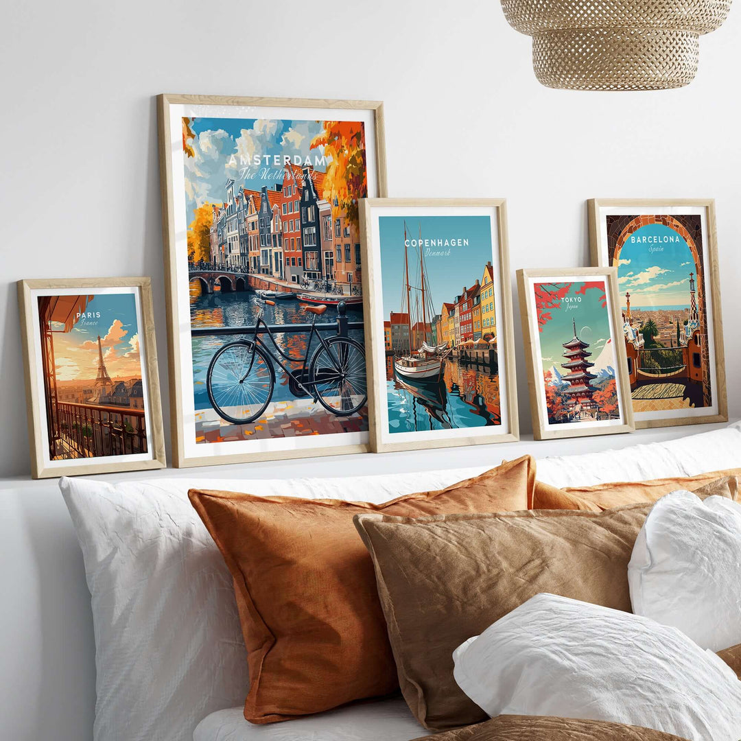 Colorful Amsterdam canal house posters displayed on a bed, adding vibrant culture and style to home decor.