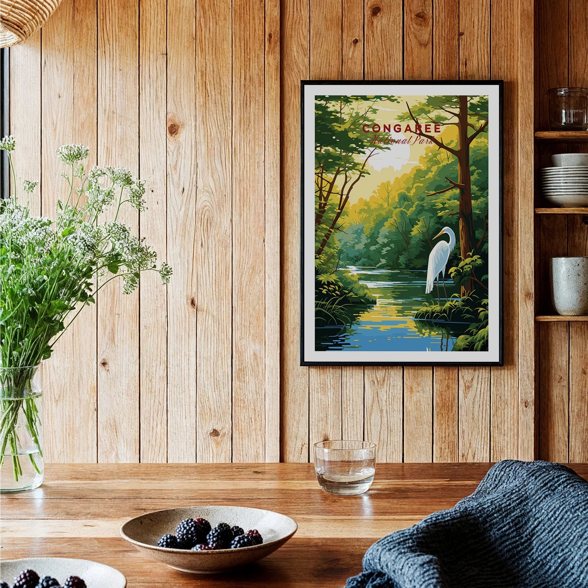 Framed Congaree National Park travel poster with heron, displayed in rustic kitchen setting