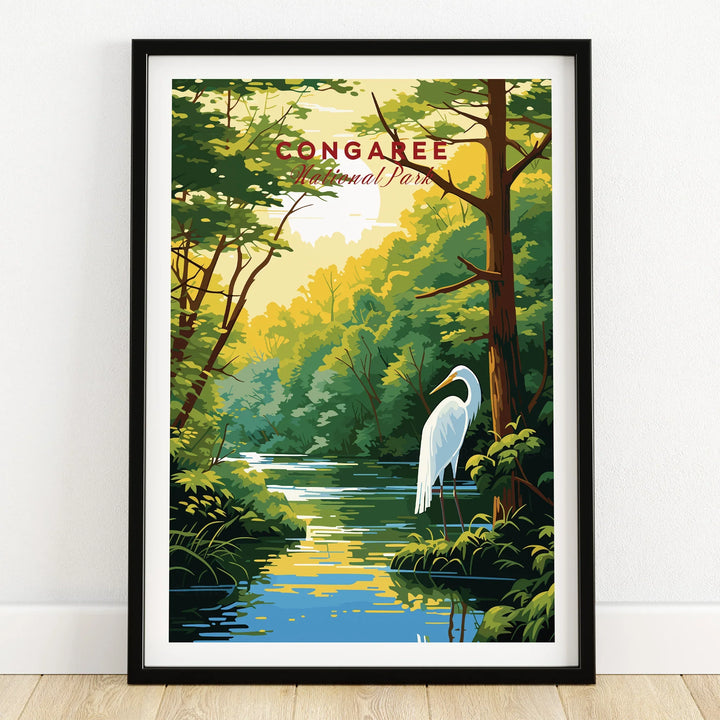 Framed Congaree National Park art print with heron, forest, and river, on wooden floor