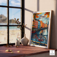 Copenhagen Autumn Art Print - Denmark Canal View, Red Bike Poster displayed next to a window with beach in the background.