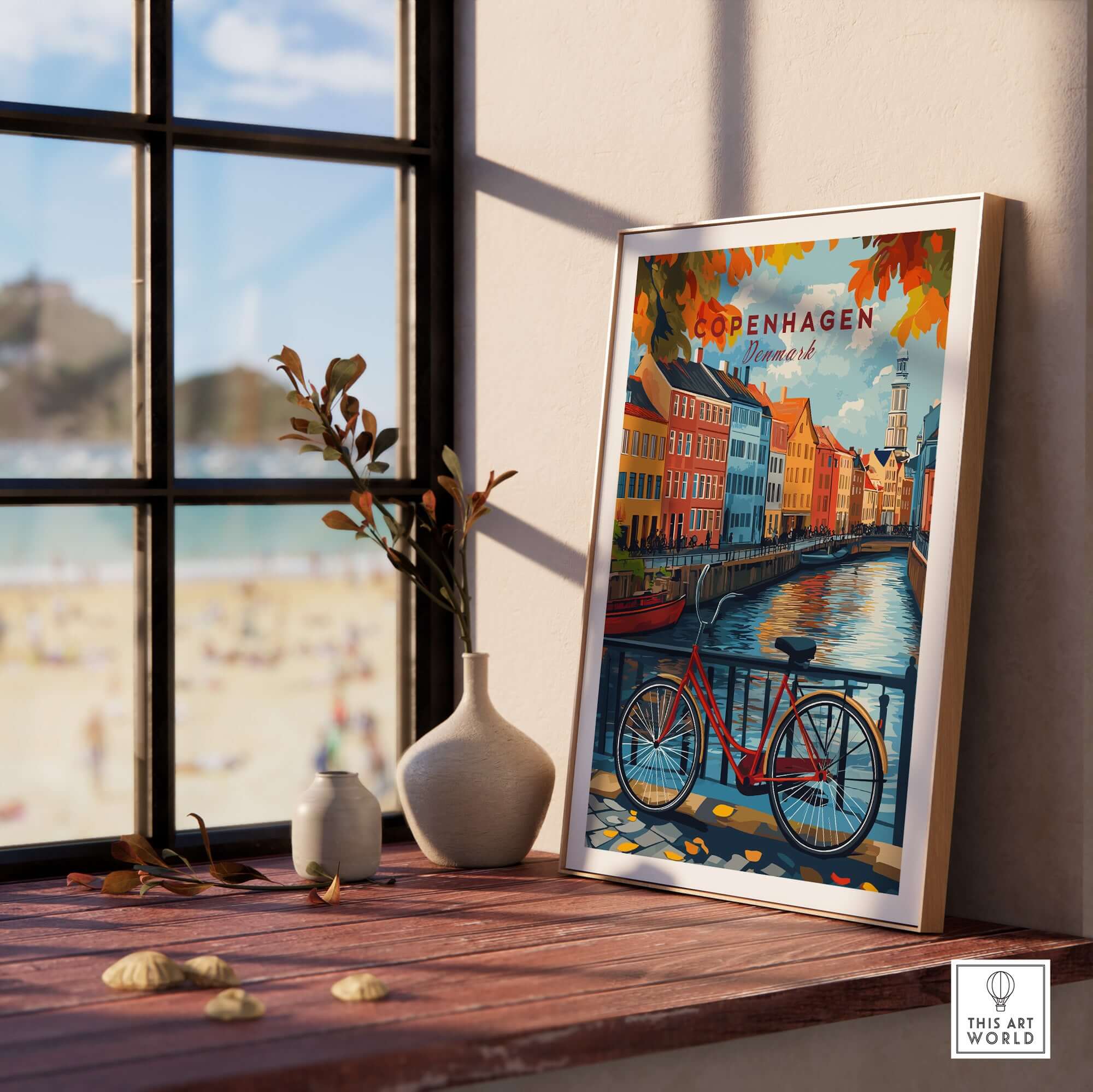 Copenhagen Autumn Art Print - Denmark Canal View, Red Bike Poster displayed next to a window with beach in the background.