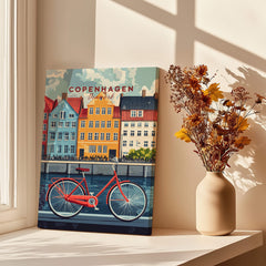Copenhagen Denmark Art Print - Cityscape Poster, Red Bicycle Canal View displayed near a vase with flowers.
