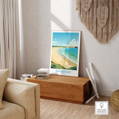 Modern Daymer Bay wall art print in a cozy living room, showcasing the beauty of Cornwall's coastline.