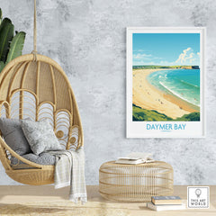 Modern Daymer Bay wall art print in a cozy living room setting with a rattan chair and decorative accents.