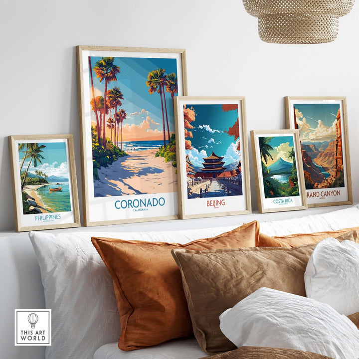 Coronado travel poster among framed travel artwork, showcasing idyllic beaches and scenic destinations for travel enthusiasts.