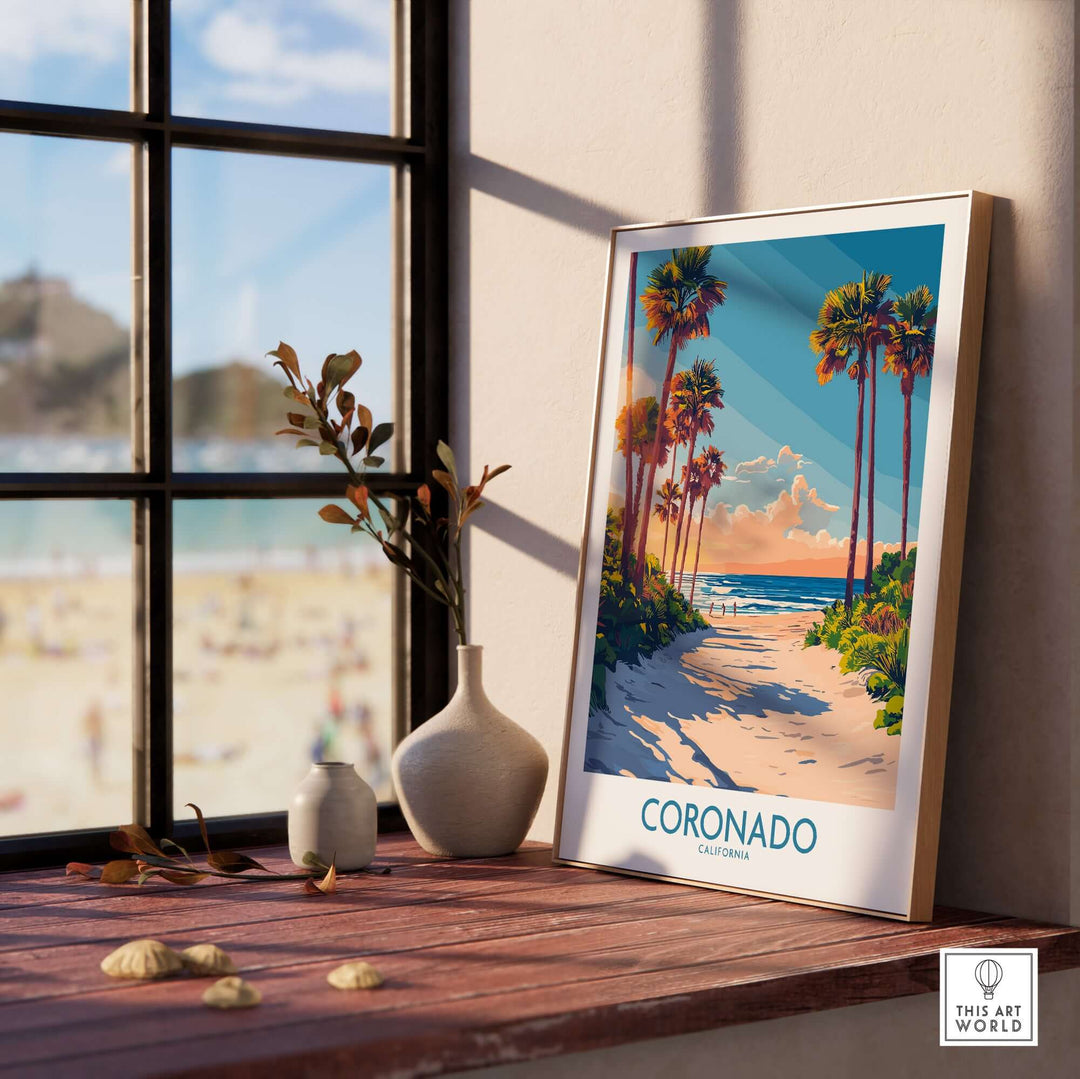 Coronado travel poster displayed by a window, showcasing palm trees and beaches, perfect for beach lovers and travel enthusiasts.