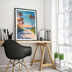 Coronado Travel Print displayed in a modern home office setting with palm trees and beach scenery.