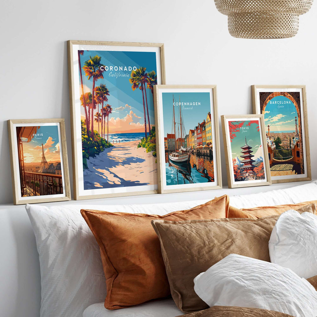 Coronado Travel Print showcased among other travel prints on a stylish bed, enhancing home decor with vibrant beach scenery.