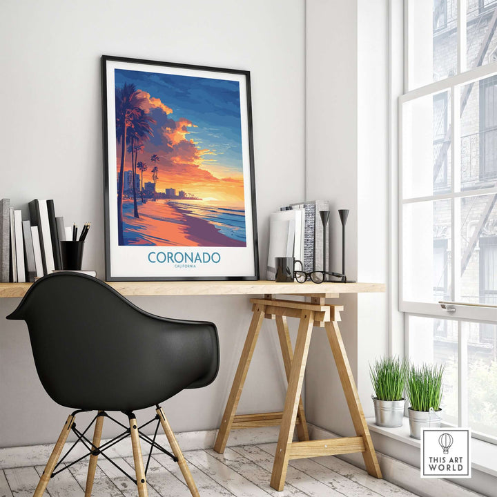 Coronado wall art print featuring a vibrant sunset over the beach, framed on a stylish desk in a modern interior setting.