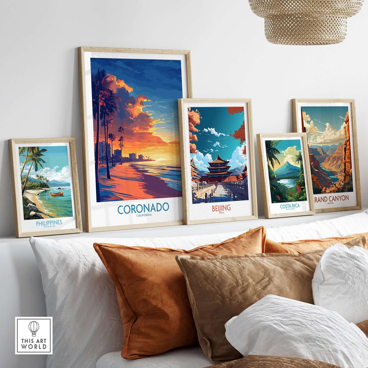 Framed Coronado Wall Art Print showcasing a sunset beside other travel-themed prints on a stylish shelf.