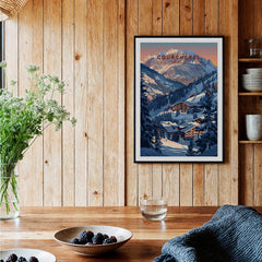 Courchevel Travel Poster - France displayed in a cozy interior with wood accents and a plant.
