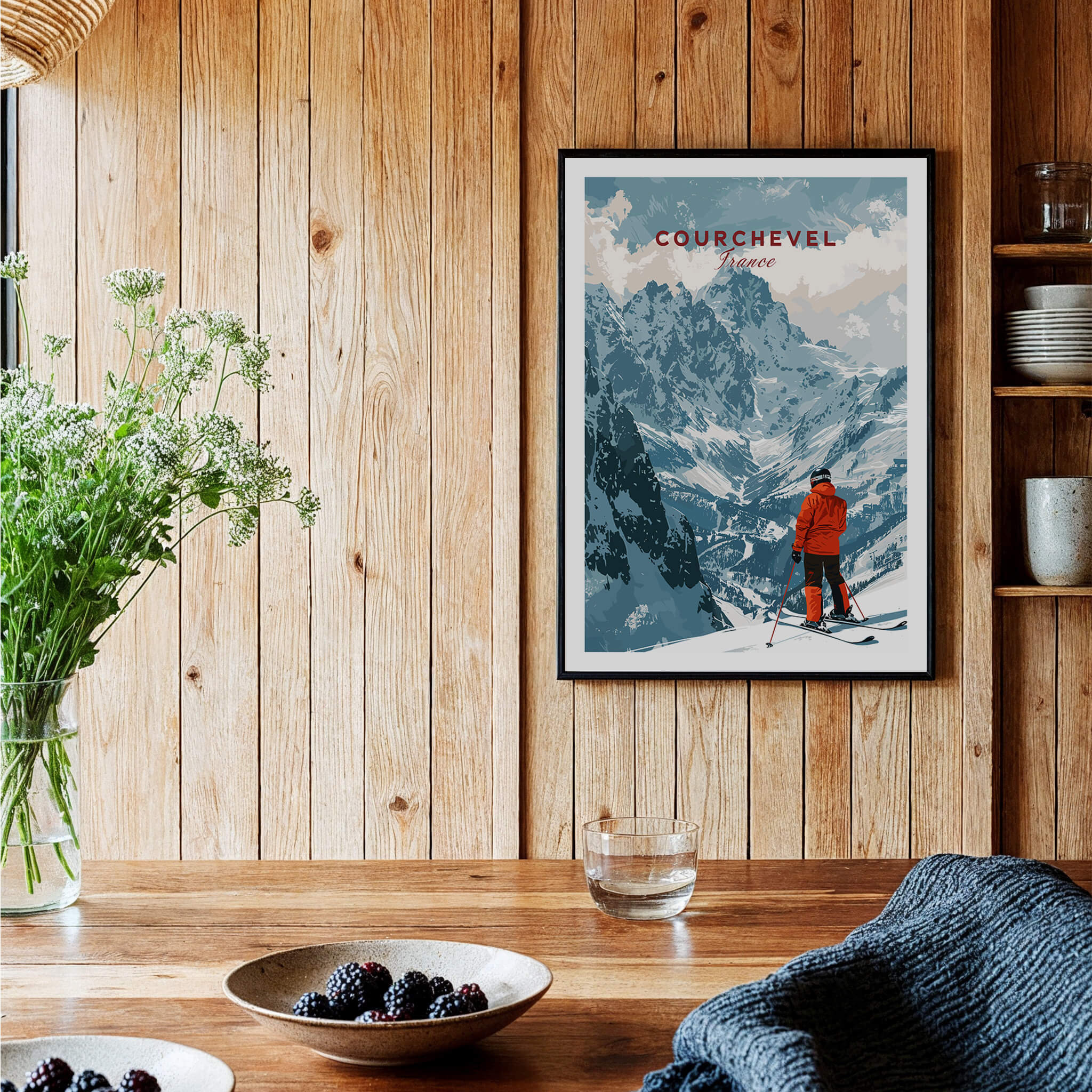 Courchevel Ski Poster showcasing the captivating ski resort scenery and a skier in a vibrant orange outfit.