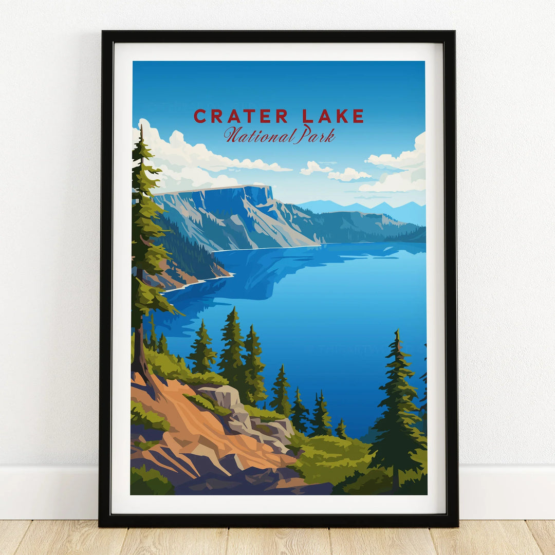 Crater Lake National Park art print in black frame on wooden floor, featuring a scenic landscape with blue lake, pine trees, and mountain cliffs.
