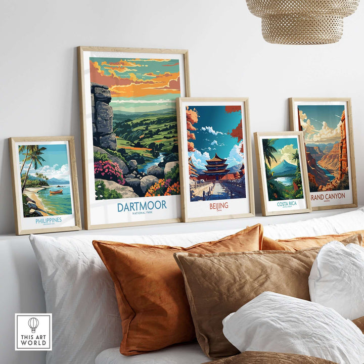 Dartmoor National Park print among other framed travel artwork in a stylish living room setting.