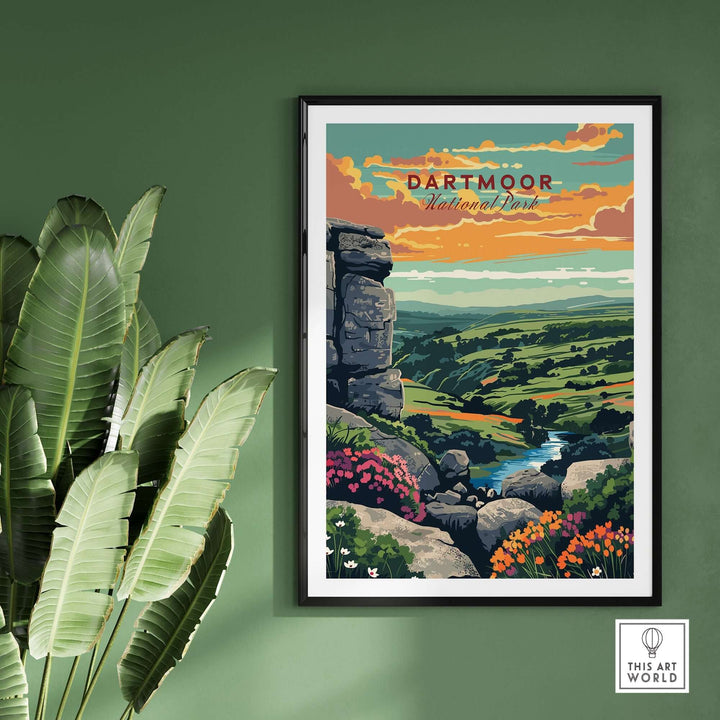 Dartmoor National Park print showcasing rugged landscapes and vibrant colors, framed against a green wall with plants.