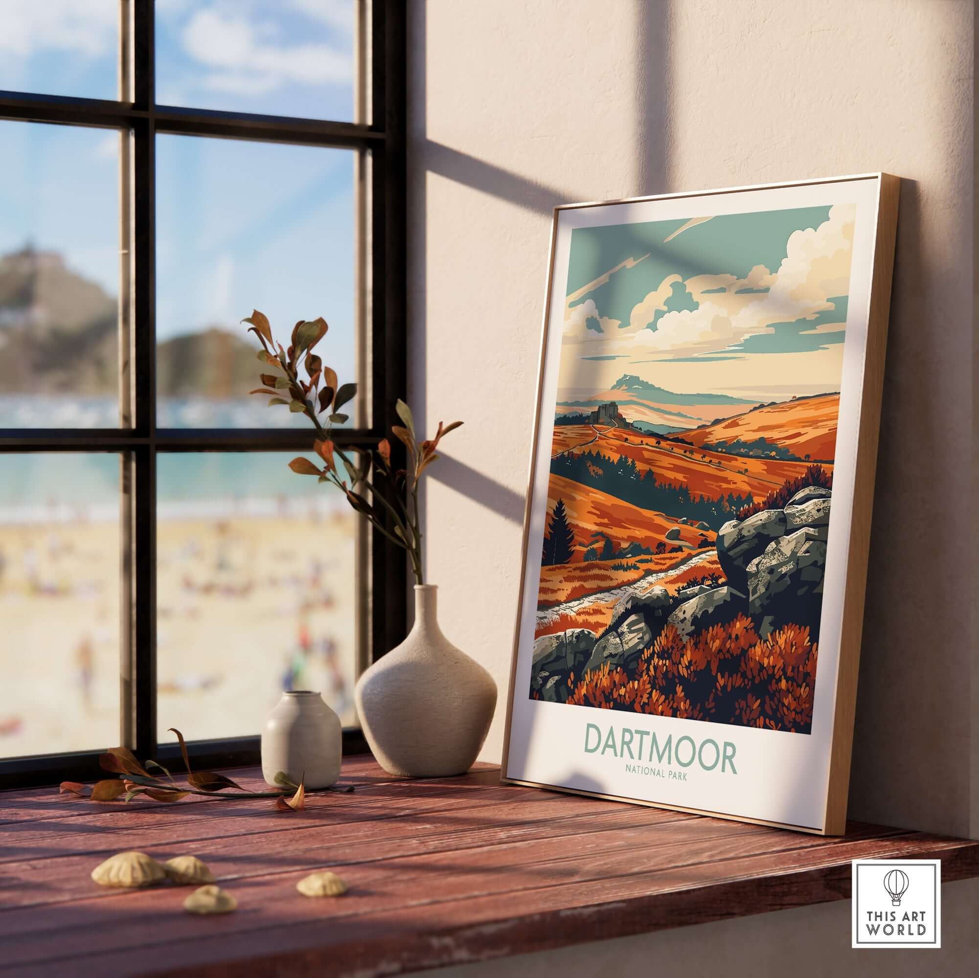 Dartmoor Poster National Park displayed on a wooden table with a scenic view through the window, showcasing beautiful landscapes.