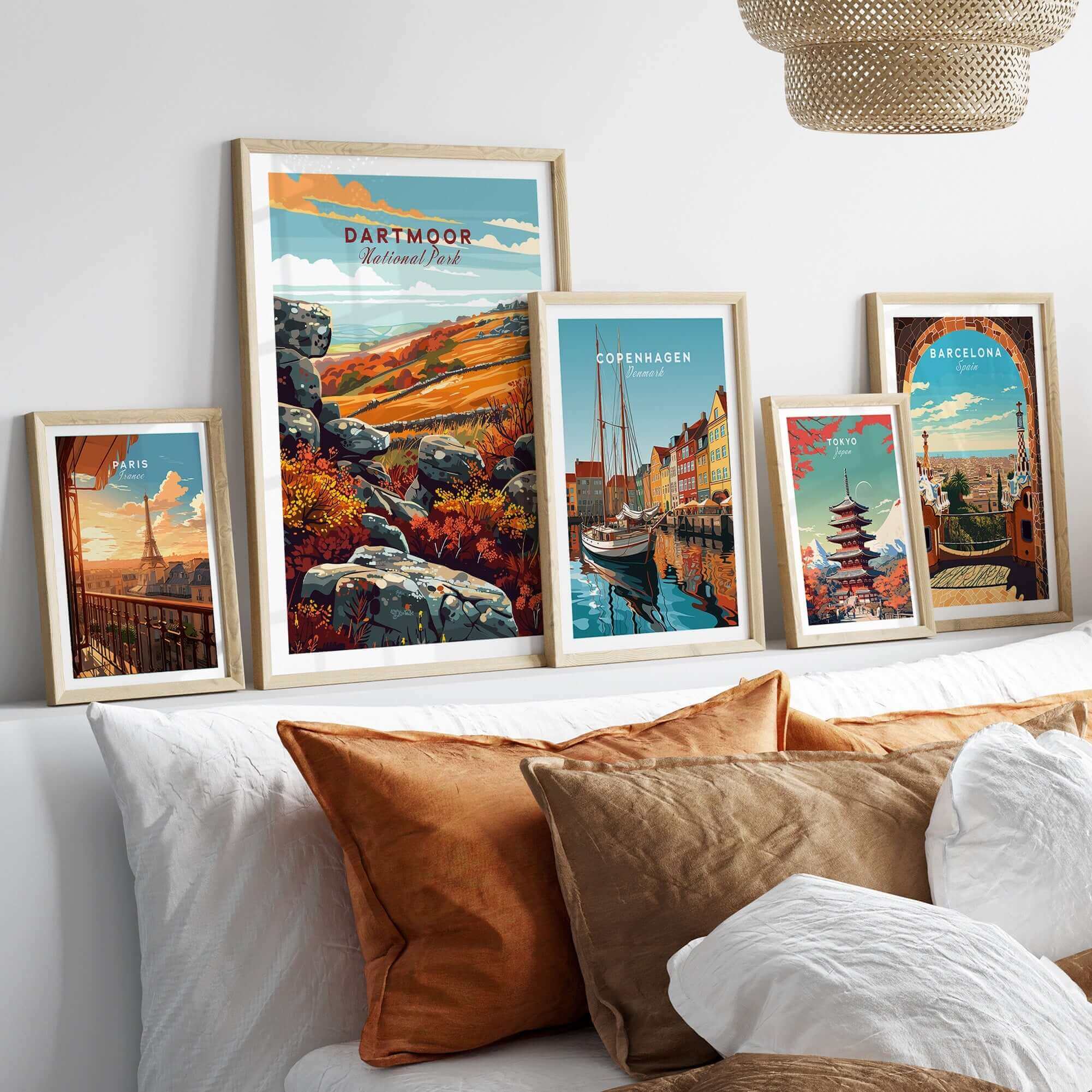 Dartmoor Poster National Park framed among other travel posters on a cozy sofa, perfect for home decor.