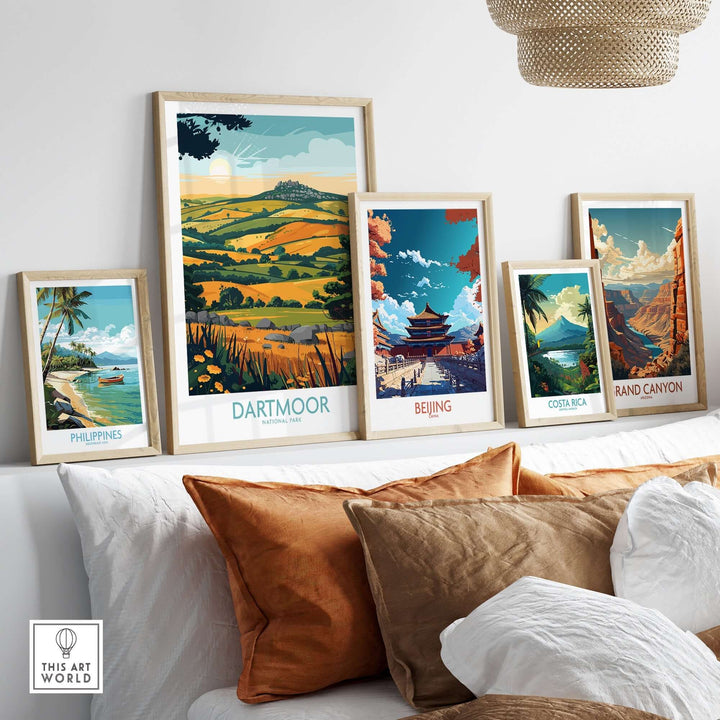 Dartmoor wall art showcased among framed prints of the Philippines, Beijing, Costa Rica, and the Grand Canyon on a stylish sofa.