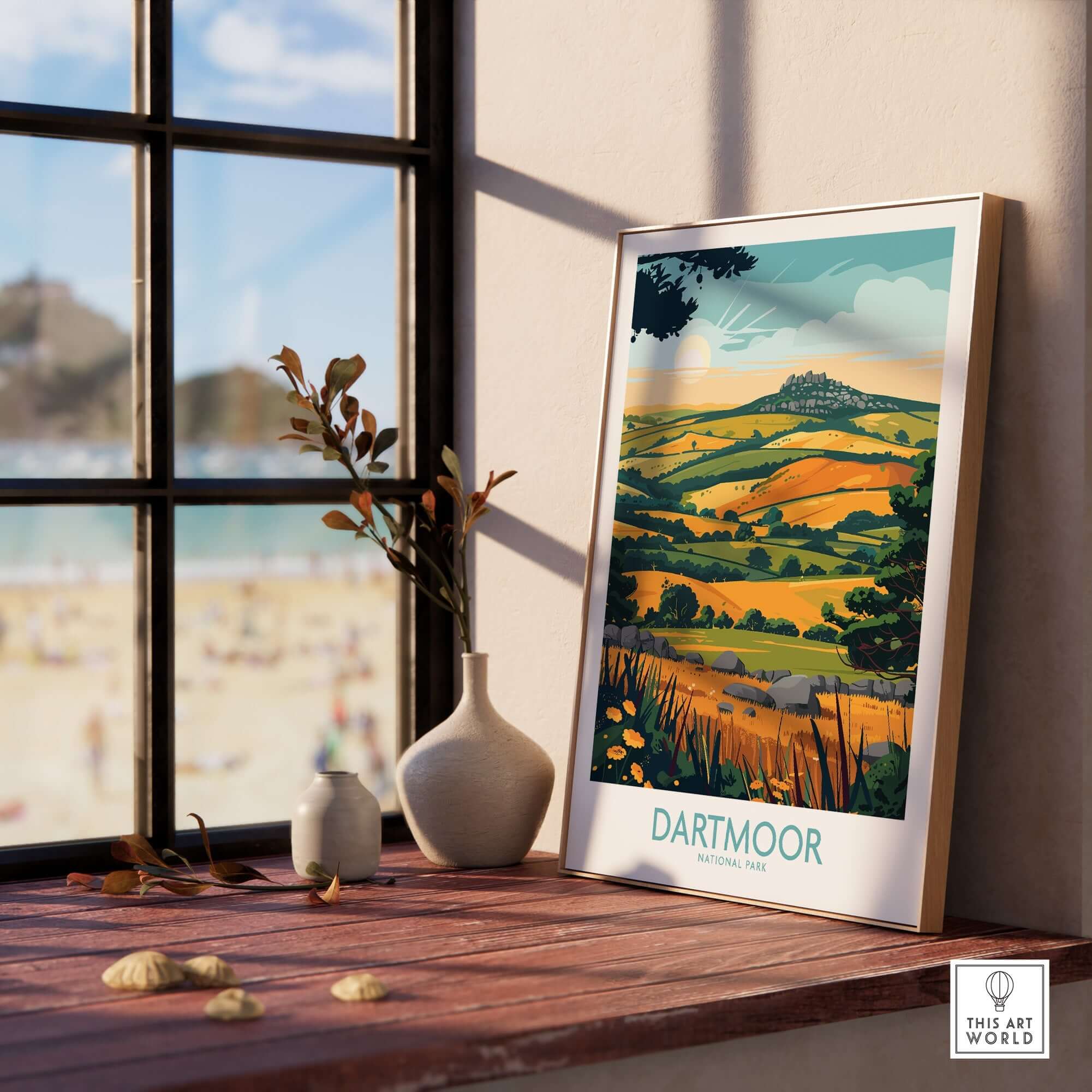 Dartmoor Wall Art displayed on a wooden shelf with a scenic view of Dartmoor National Park through the window.
