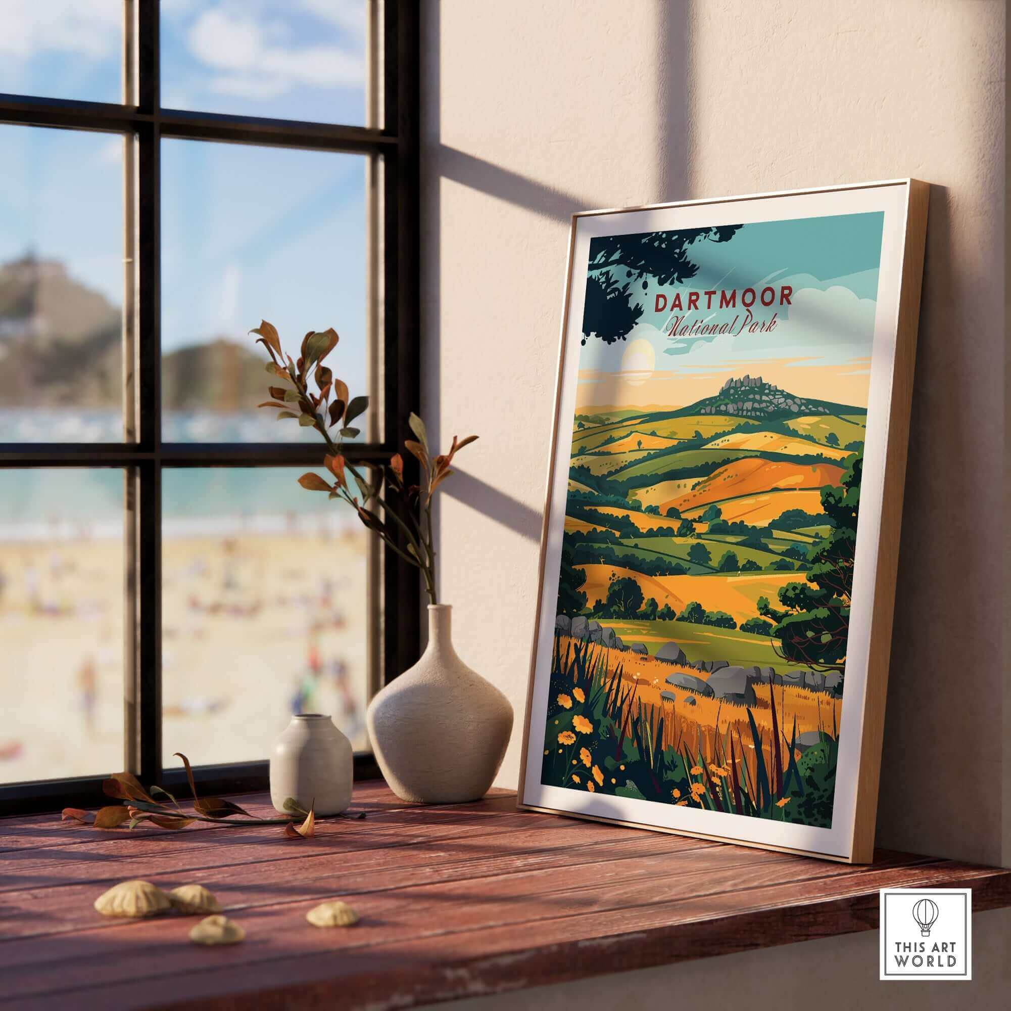 Dartmoor Wall Art Print displayed on a wooden table with a scenic view of Dartmoor National Park in the background.