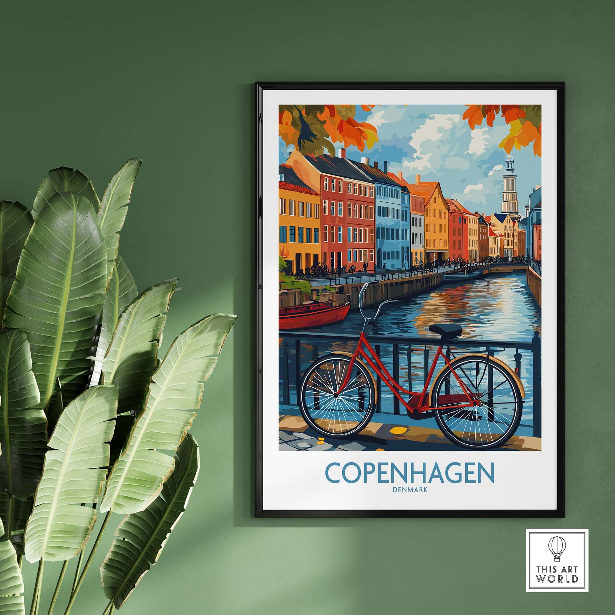 Denmark Copenhagen Fall Poster - Red Bicycle, Colorful Canal Houses Art displayed in a modern interior with green leaves.