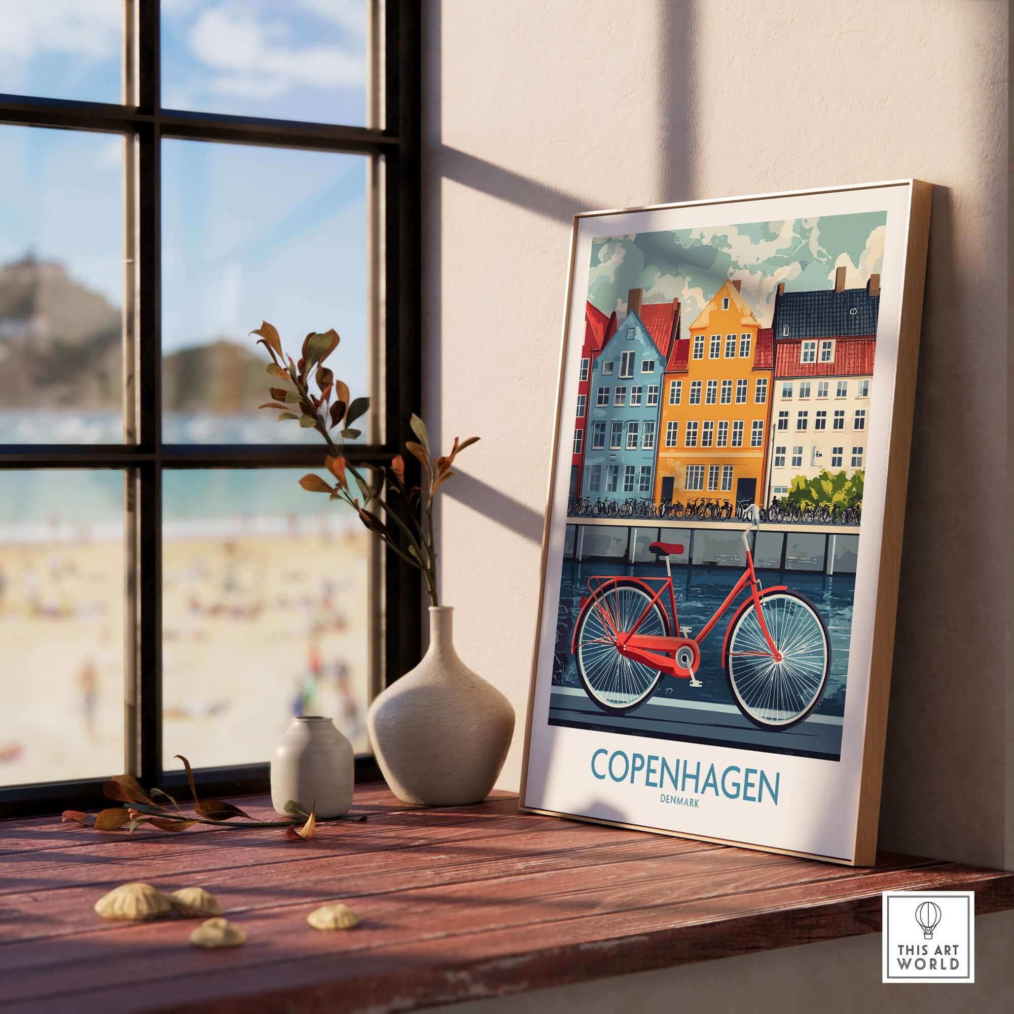 Denmark Copenhagen Poster - Red Bike, Colorful Canal Houses Art displayed on a shelf in a bright room by a window.