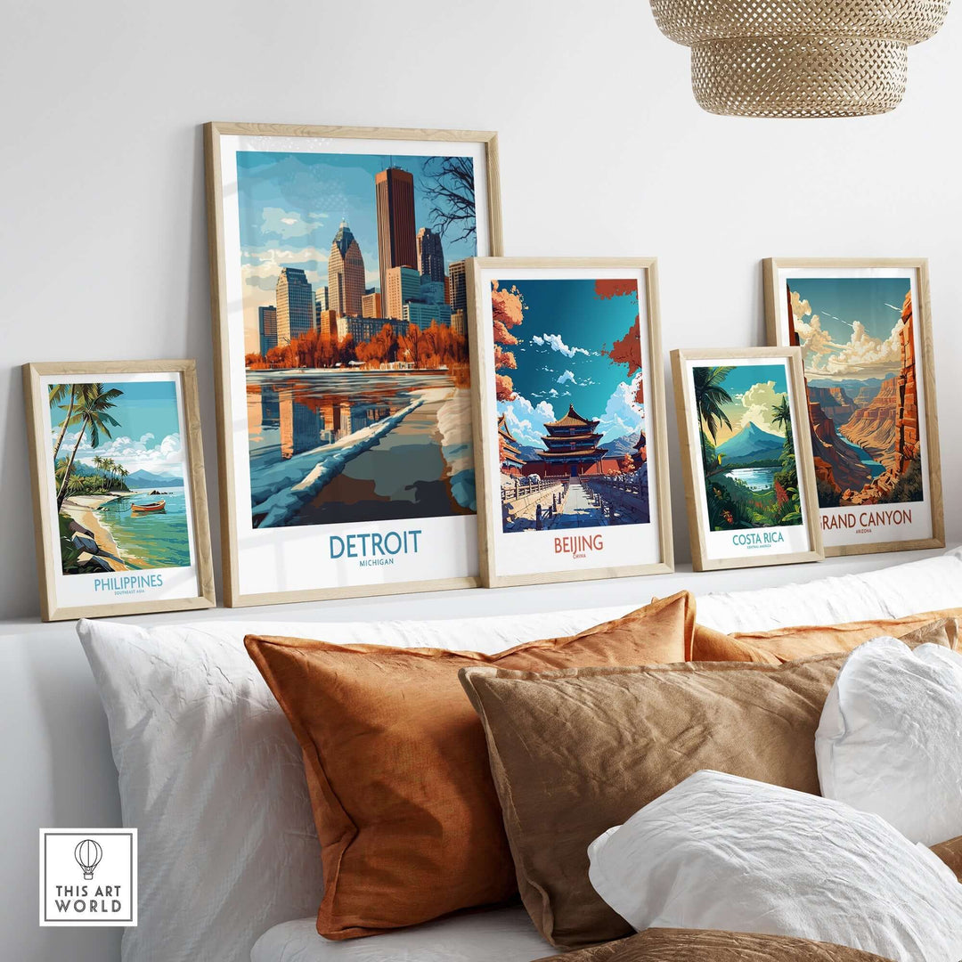 Framed travel posters including Detroit, Beijing, Philippines, Costa Rica, and the Grand Canyon displayed on a stylish couch.